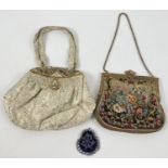 2 1940's evening bags together with a small crochet and bead coin purse. A French satin lined