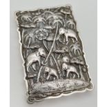 An unmarked antique Anglo-Indian silver card case with highly detailed embossed decoration to both