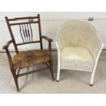 A vintage wooden rush seated low armchair with shaped spindle style back (seat a/f). Together with a