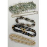 A collection of vintage costume jewellery necklaces to include pearls, natural stone and glass.