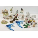 A box of assorted vintage ceramics to include birds, bells and miniature floral ornaments.