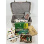 A vintage 'Pixie' suitcase with a collection of assorted vintage Christmas decorations & boxed