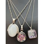 3 silver pendant necklaces. A foil glass pendant in a marked 925 silver mount on a 17" silver box