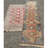 2 vintage Indian style rugs. A beige ground tassled ended rug with geometric style design together