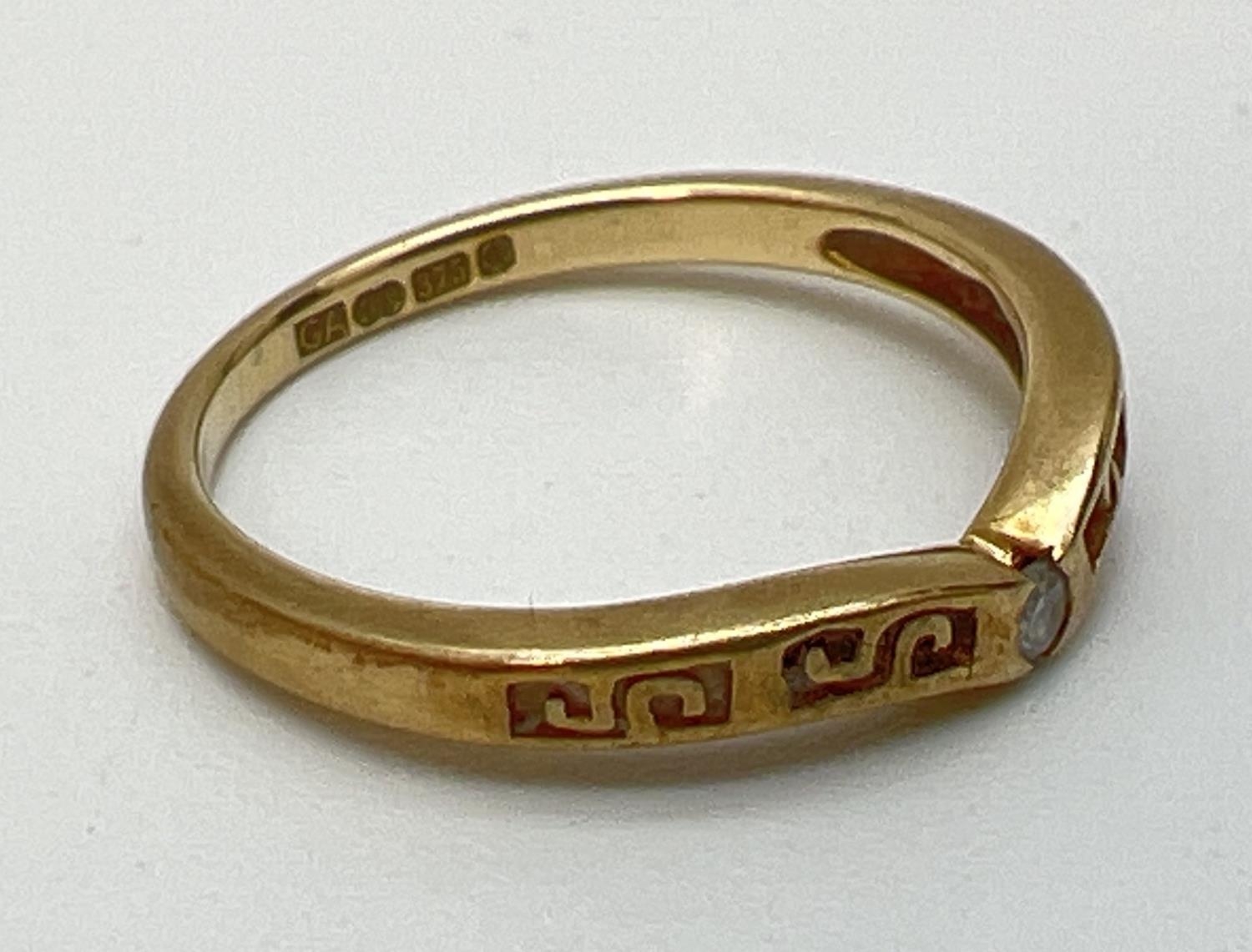 A 9ct yellow gold wishbone ring set with central diamond and with pierced work detail. Fully - Image 2 of 3