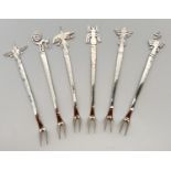 A set of six Peruvian silver hors d'oeuvres forks. All with insect, animal or native symbol