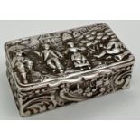 An Edwardian silver repousse trinket box of scroll and foliate design to 4 sides and embossed