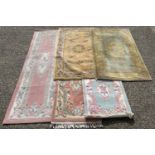 5 Chinese style rugs with floral detail, in varying colours and sizes. To include pink ground