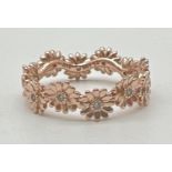 A 14ct rose gold Sparkling Daisy Flower Crown ring by Pandora. Inside of band marked Ale Met 54.