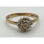 A 9ct gold diamond cluster ring, fully hallmarked inside band. Ring size L.