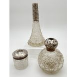3 antique cut glass silver topped vanity pots with embossed scroll & foliate detail. Scent bottles