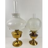2 vintage brass based oil lamps with glass shades and chimneys. Largest approx. 60cm tall (with