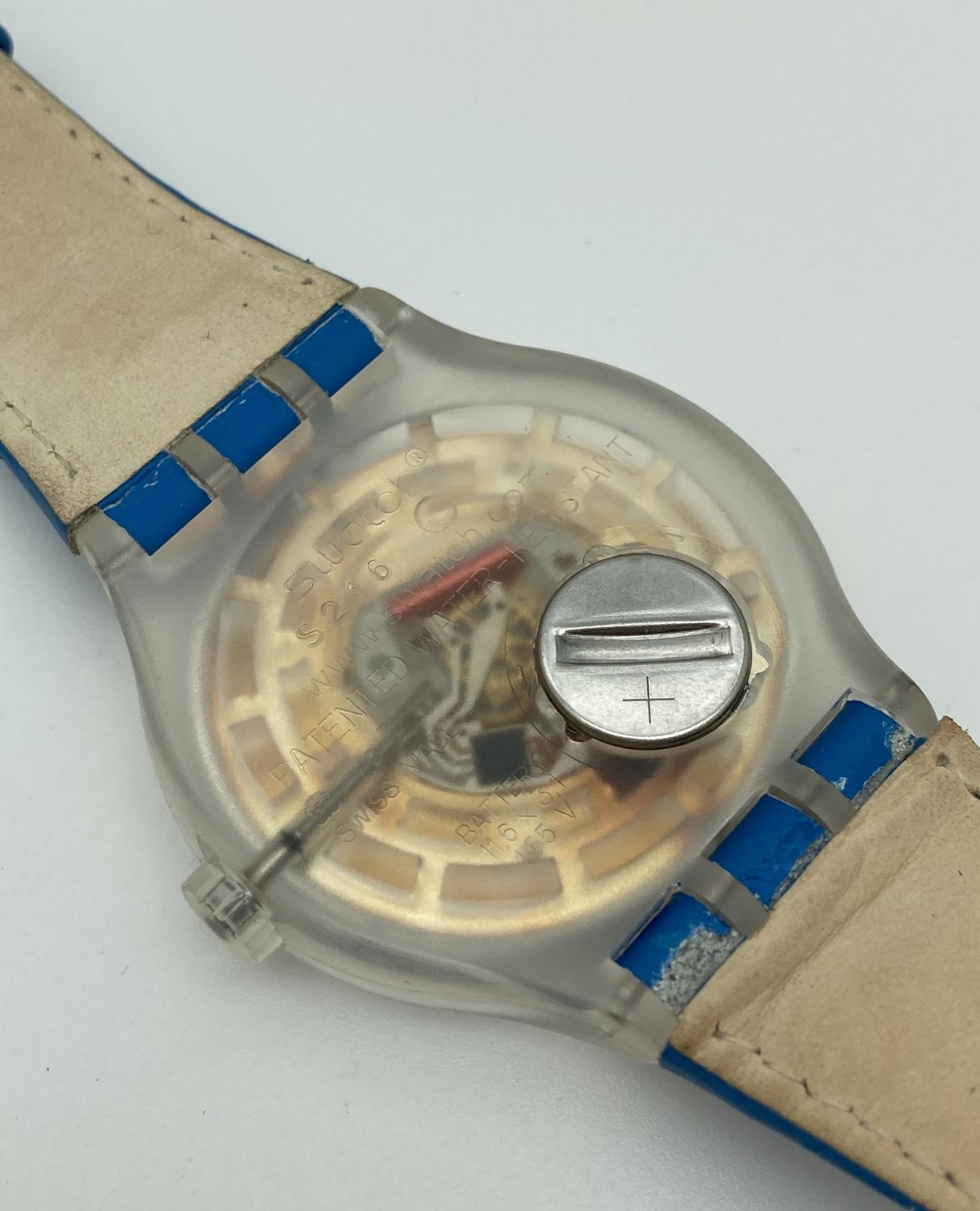 A unisex S216 Swatch watch with metallic blue face and original blue leather strap. Luminescent - Image 3 of 4