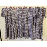 8 vintage theatre company short sleeved dresses in matching tartan style material.