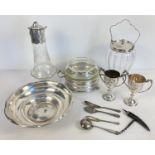 A collection of silver plated and glass items. To include a sugar sifter spoon, biscuit jar,