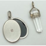 2 silver pendants. A 925 silver mounted clear quartz pointed crystal pendant (approx. 3.25cm long)
