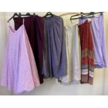 6 assorted theatre company full length skirts, in varying colours and patterns.