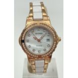 A ladies two tone bracelet strap wristwatch by Sekonda. Goldtone case set with clear crystals.