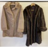 2 womens vintage coats. A dark brown swing fur coat with turn back cuffs. Together with a pale