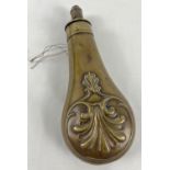 An antique brass powder flask with decorative fan and scroll detail. Broken spring. Approx. 20cm