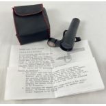 A Nikko Stirling Magnet type scope setting tool, complete with instructions and pouch/case.
