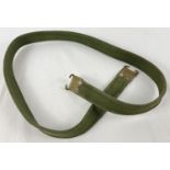 A green canvas sling for an Enfield No. 4 rifle. Approx. 111cm long.