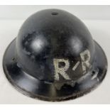 A British WWII Home Front MkII steel helmet painted with white letters R/R. Helmet stamped BMB 1939,