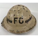 WWII British MkII Home Front Fire Guard steel helmet c1939, and arm band. Painted white with