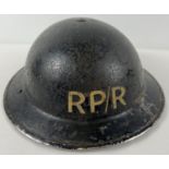 A WWII British MkII Home Front steel helmet labelled RP/R in white front & back. For Repair Party/