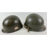 A WWII US M1 steel helmet (c1944-45), rear seam, as used in the Korean & Vietnam War. Two bullet