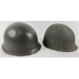 An Argentine M1 steel helmet, front rim stamped 1858/B37. This is a repainted US rear seam M1