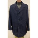 A mens Hugo Boss navy blue fully lined overcoat. Size 40 R.