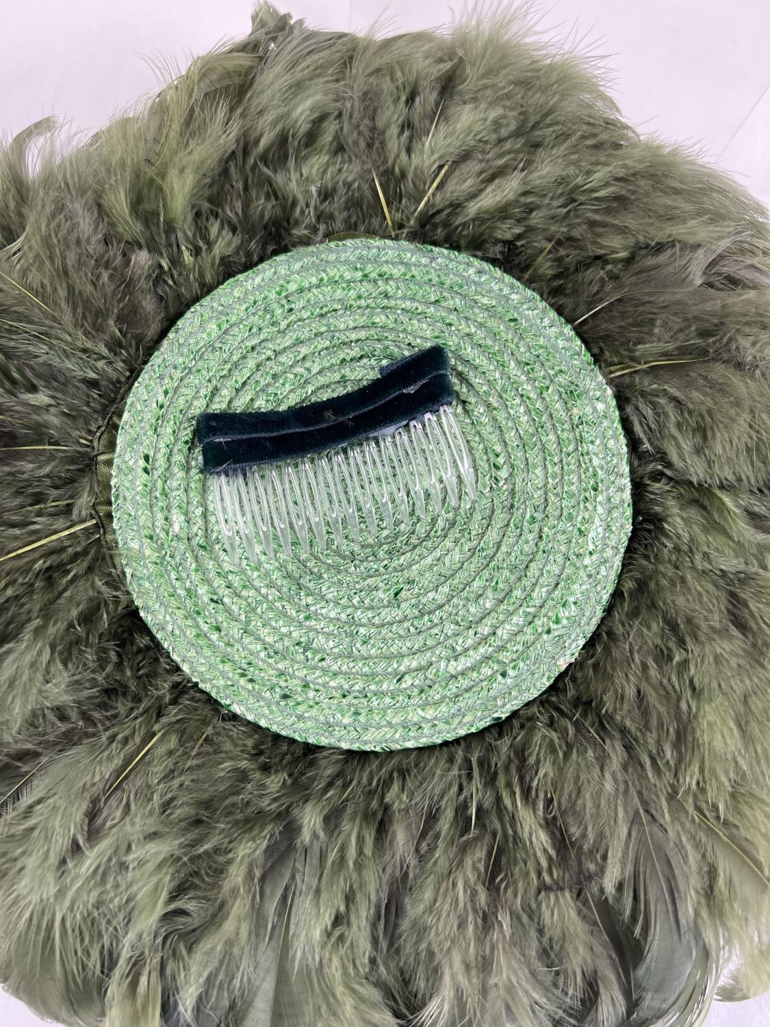 A green feather fascinator style hat with pheasant feather and net detail. Together with a Harvey - Image 4 of 4
