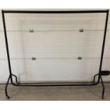 A 4 sectional black metal clothes rail on wheels. With sturdy hollow metal tubes. Approx. 159cm tall