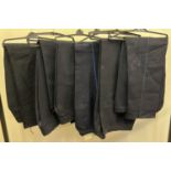 6 pairs of dark blue trousers with a blue piped leg stripe.