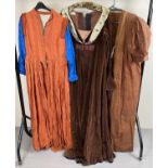 3 vintage medieval style theatre costume outfits, in brown tones.