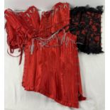 4 theatre costume corsets, one with black lace & red floral design. Together with 3 red satin with