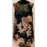 A Ted Baker sleeveless swing dress with floral print chiffon overlay. Zipped and collared detail