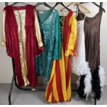 4 theatre costume dresses in varying colours & a blue dress style jacket.