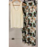 2 items of womens clothing by Maje. A pair of wide legged crepe trousers together with a cream