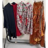 3 theatre costume capes in varying materials and styles.