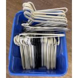 A box of 70 assorted plastic white, black & silver coat hangers, of the same design.