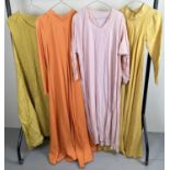 4 medieval style theatre costume long length tunic dresses. In orange and yellow tones.