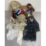 A box of assorted theatre costume hats and headdresses.
