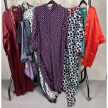 A collection of assorted vintage nightwear and loungewear. To include: fleece onsies, green silk