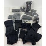 A box of 18 assorted pairs of black stockings and tights together with some suspender elastics.