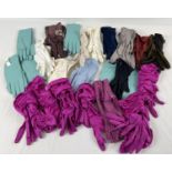 24 pairs of vintage and costume gloves. In varying colours and styles.