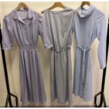 3 1980's day dresses in shades of grey to include a long sleeve with cowl neck and a sleeveless