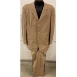 A 2 piece camel coloured mens suit by Nicole Farhi. Damage to inside lining, trousers approx. 36