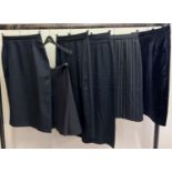 6 vintage and modern black skirts, mostly pencil style to include 1980's with button detail to front